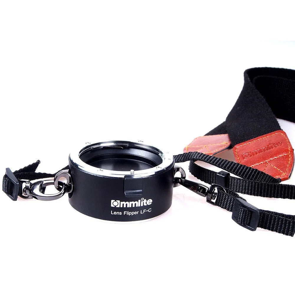 Aluminium alloy Nikon E-Mount lens flipper holding two camera lenses with cotton shoulder strap