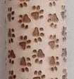 Wooden rolling pin with engraved Christmas patterns including reindeer and snowflakes on a 45cm long barrel.