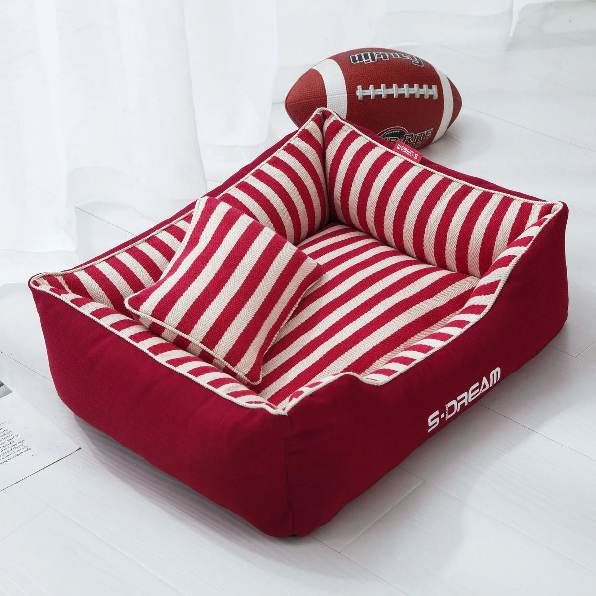 Navy striped removable dog kennel mat with a matching mini pillow, shown in blue and red colour options.