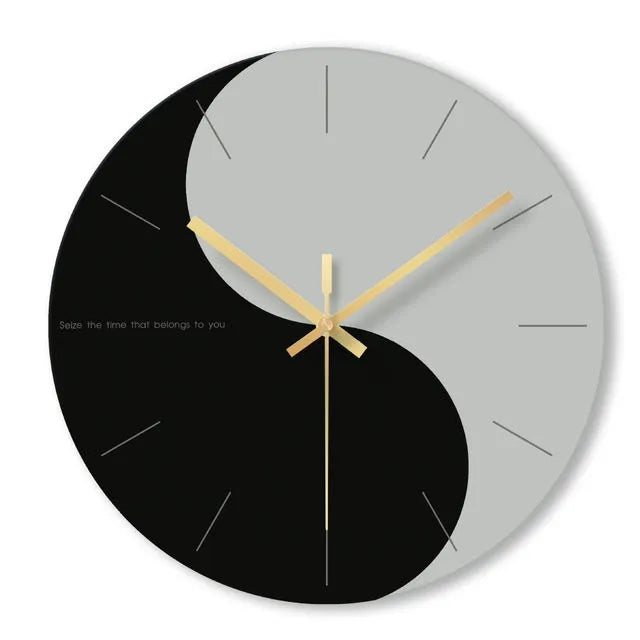 A large, clear tempered glass wall clock with a minimalist transparent face on a light background.