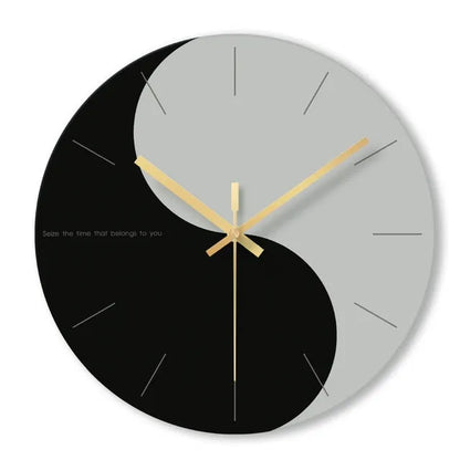 A large, clear tempered glass wall clock with a minimalist transparent face on a light background.