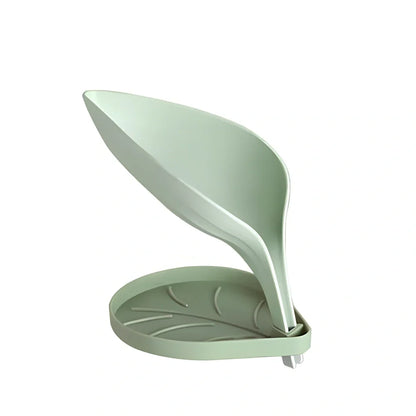 Blue bathroom soap dish with tree texture pattern and drainage channels on white ceramic sink