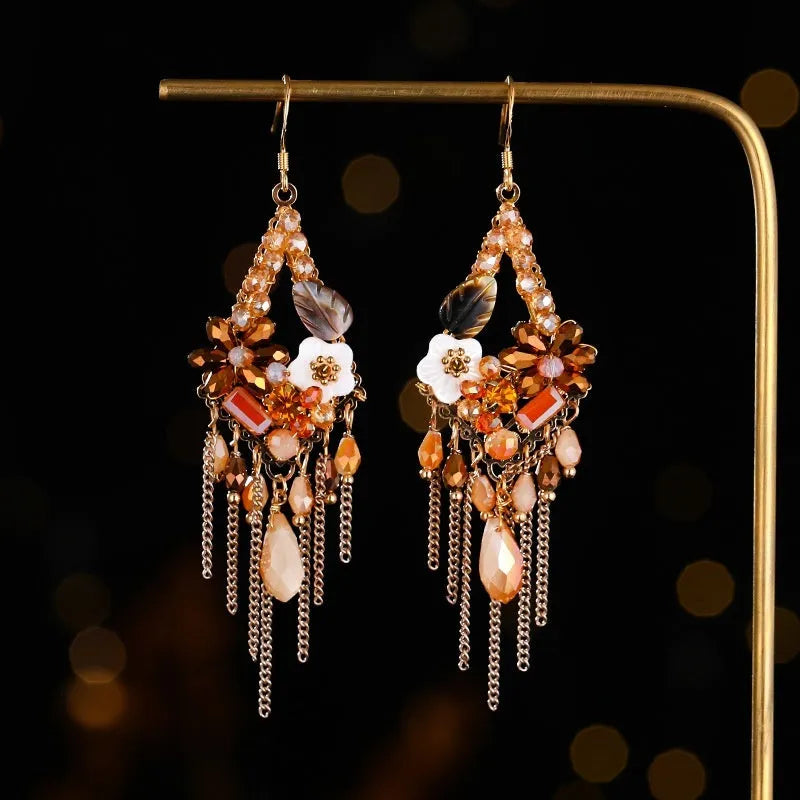 Hand-woven bohemian long earrings with artificial crystal detailing in red and black, champagne, or amethyst colours