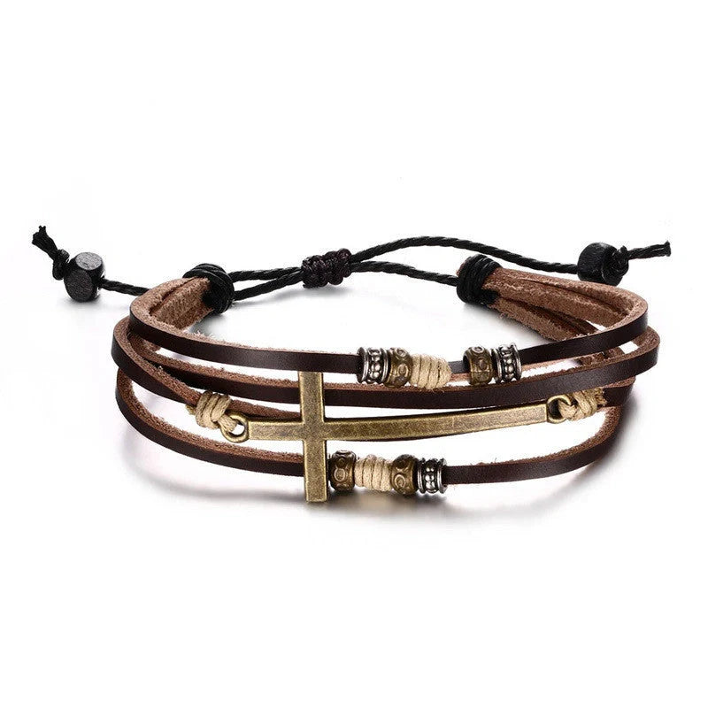 A handcrafted leather bracelet featuring a cross design, perfect for adding a touch of rustic style to any outfit.