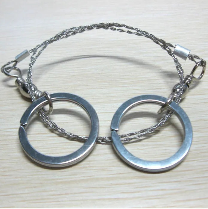 Outdoor survival wire saw with stainless steel blade and pull ring handles for camping and bushcraft