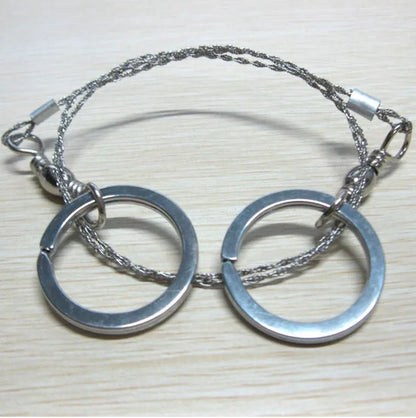 Outdoor survival wire saw with stainless steel blade and pull ring handles for camping and bushcraft