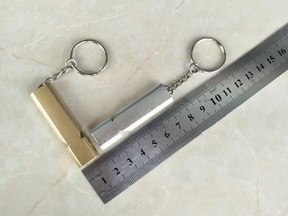 Outdoor survival whistle with keychain in gold and silver options
