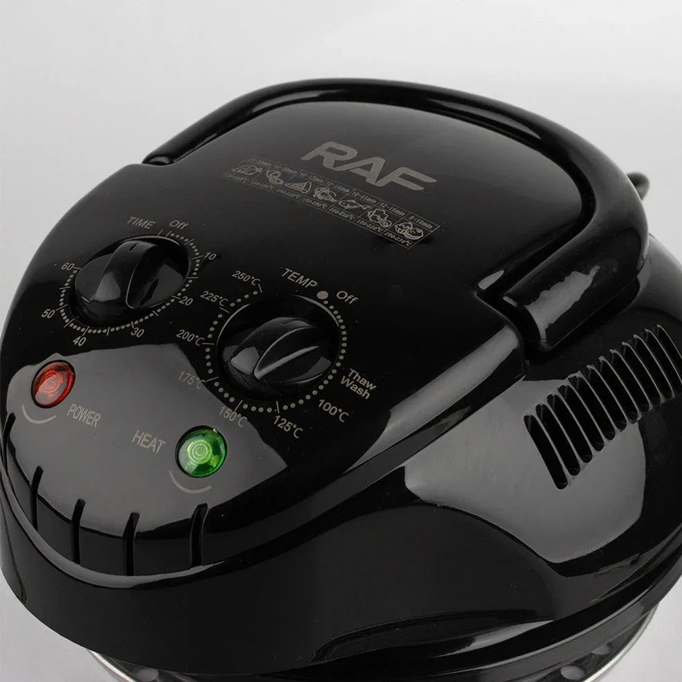 Black home air fryer with touch controls and visual window for monitoring cooking progress
