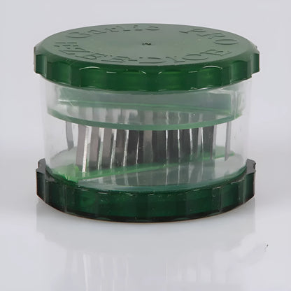 Green manual garlic peeler kitchen tool with silicone roller and plastic press handle.