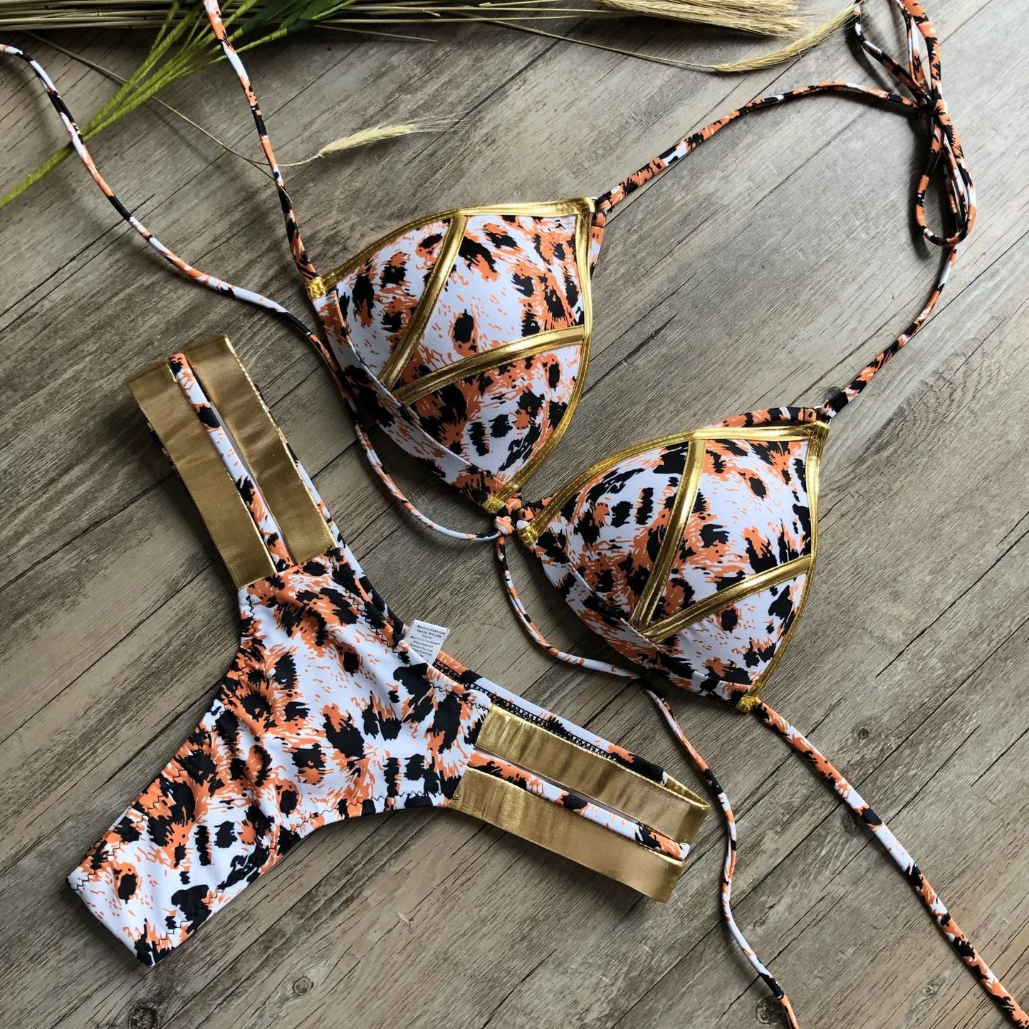 Women's bronzing bikini swimwear in nylon with cotton lining and chest pads