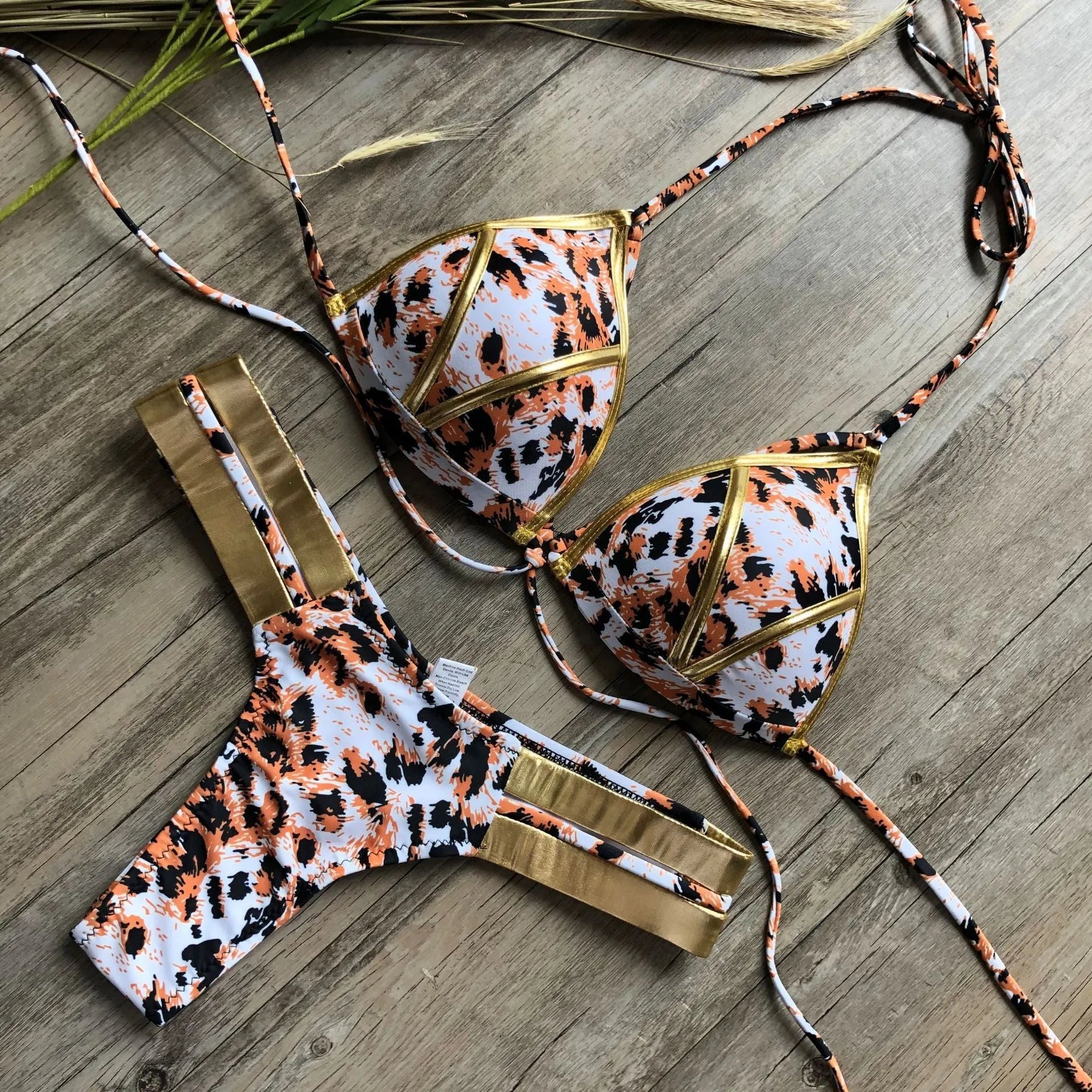 Women's bronzing bikini swimwear in nylon with cotton lining and chest pads