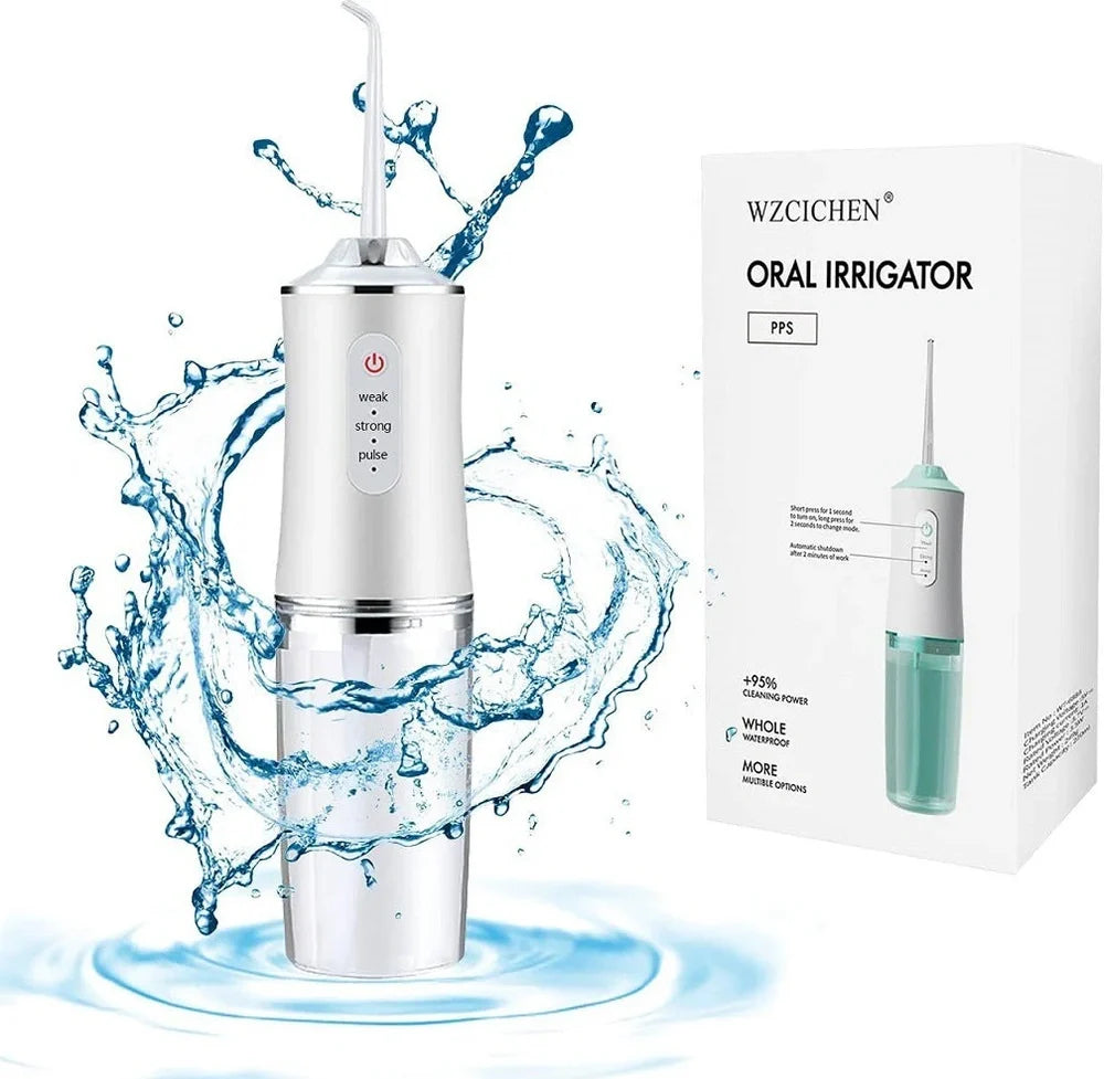 White oral irrigator with 4 nozzles showing water stream and USB charging port