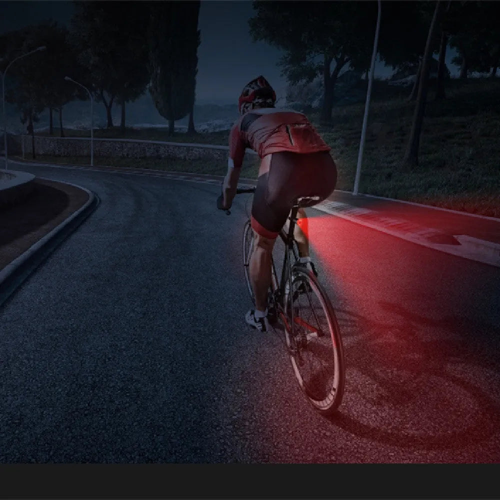 Black aluminium alloy bicycle taillight measuring 35x39x58mm with USB charging port and brake sensing technology