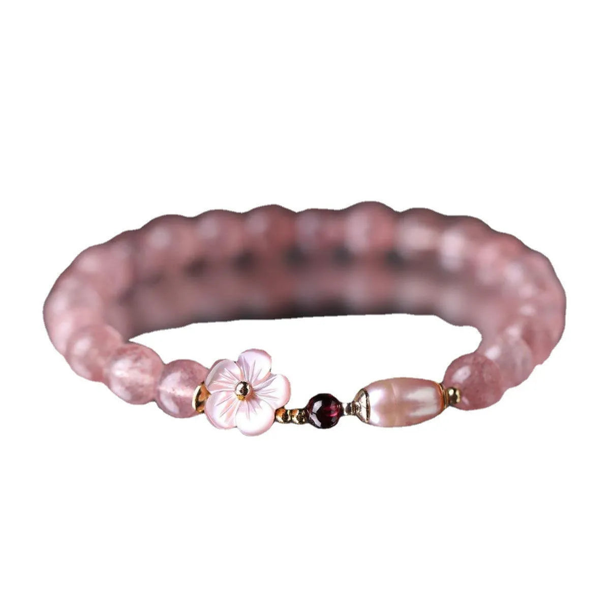 Strawberry quartz peach blossom crystal bracelet for women showing floral design.