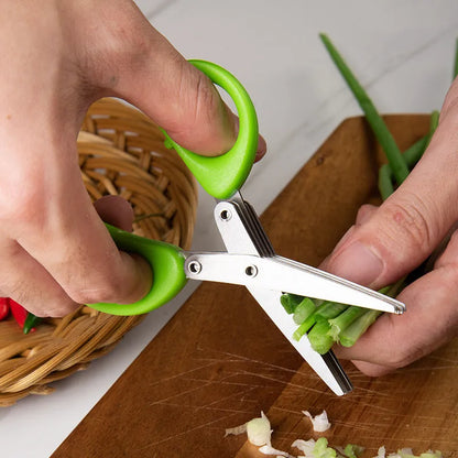 Green stainless steel multi-layer V-shaped kitchen scissors for cutting onions and herbs.