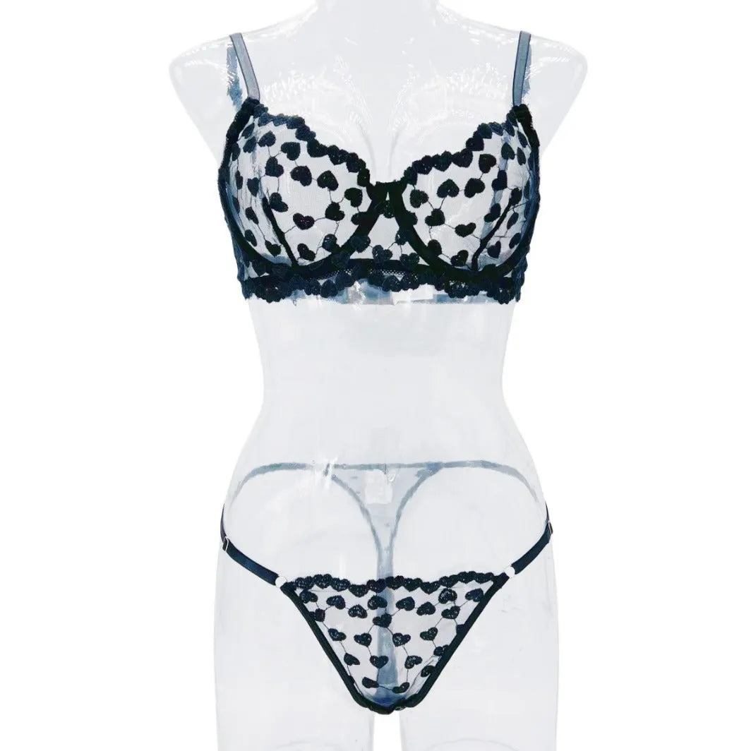 Romantic multi-colour mesh women's suit set comprising a top and trousers, shown in red and black colour options.