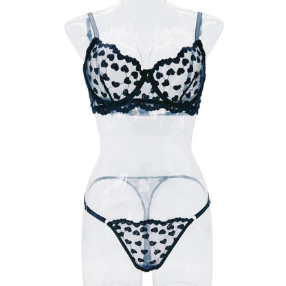 Romantic multi-colour mesh women's suit set comprising a top and trousers, shown in red and black colour options.