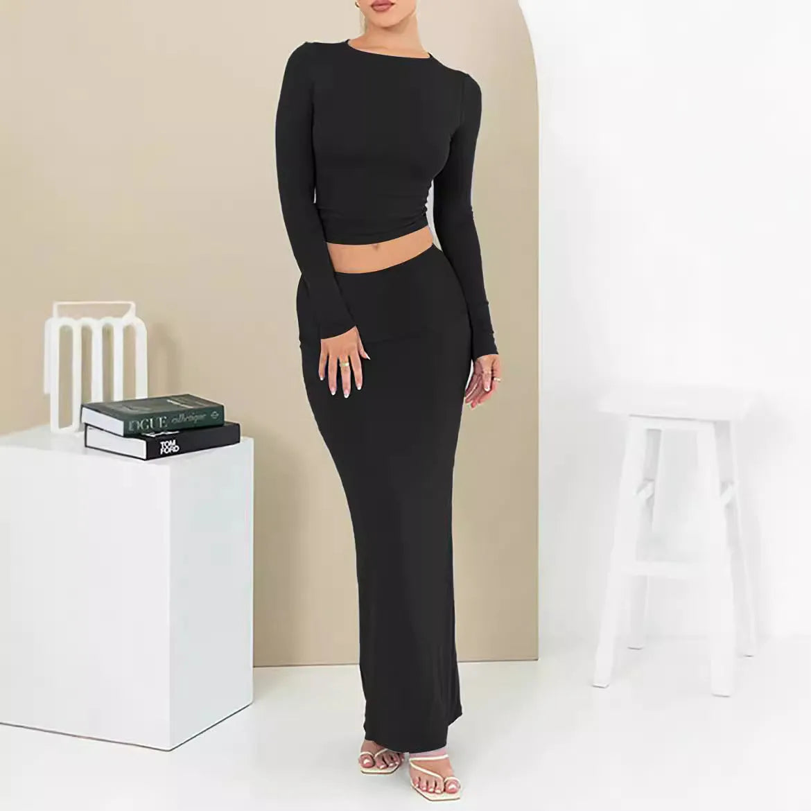 Women's black polyester two-piece suit with a sweet style, featuring a top and long skirt in a slim fit.