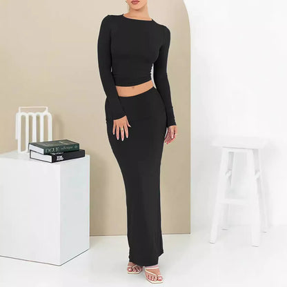 Women's black polyester two-piece suit with a sweet style, featuring a top and long skirt in a slim fit.