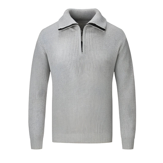 A man wearing a solid-colour slim-fit loose pullover sweater in a neutral colour.