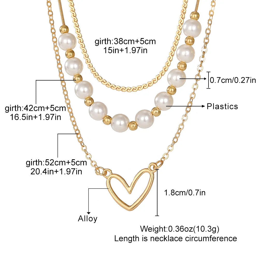 Vintage gold heart pendant necklace on a textured pearl chain, adjustable 41-50cm length.