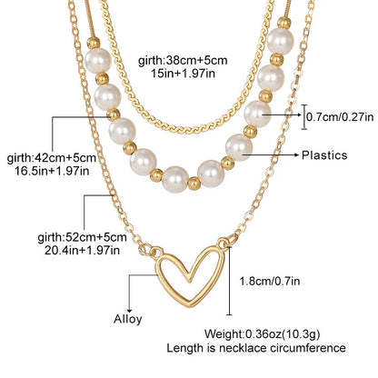 Vintage gold heart pendant necklace on a textured pearl chain, adjustable 41-50cm length.