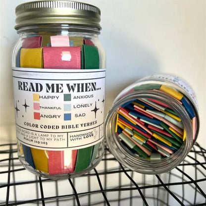 Handmade glass jar containing 67 color-coded Bible verses for emotional support