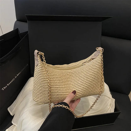 Woven straw shoulder tote bag in a horizontal square shape with a sandwich pocket.