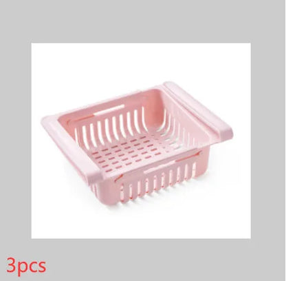 Plastic telescopic refrigerator storage basket in apricot colour, showing multiple compartments for organisation.