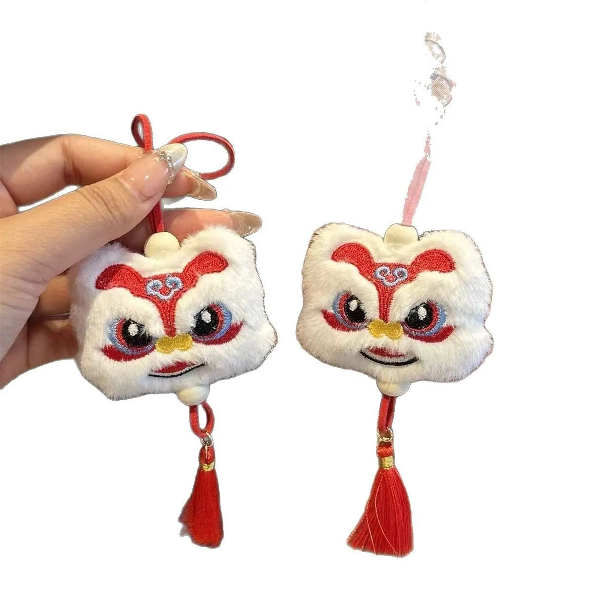 Blue and yellow Chinese style plush lion keychain ornament with star stone eyes and tassel.