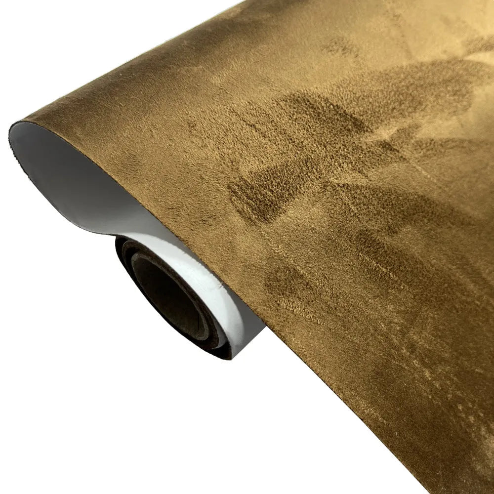 Rolls of self-adhesive leather suede in multiple colours showing texture and adhesive backing.