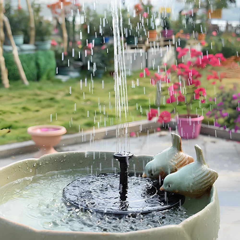 Black solar fountain with water spray in garden pond showing 55cm height and four nozzle options