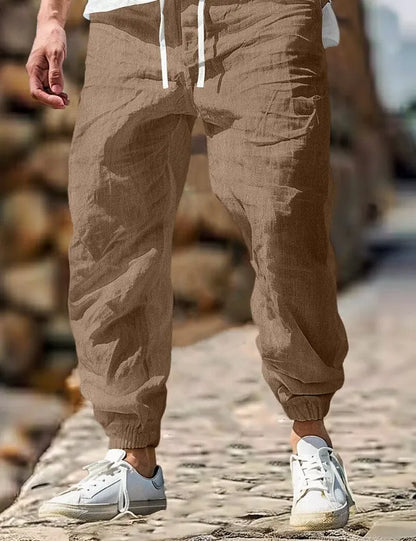 Men's straight-leg cotton trousers with elastic waist in Army Green colour, showing front and back views.