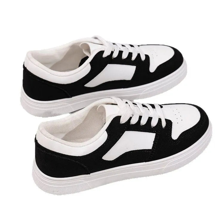 Black women's low-top lace-up casual sports shoes with a round toe and flat rubber sole.