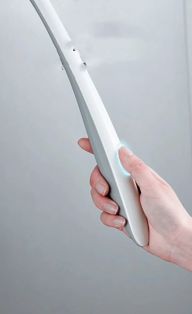 Black silicone bathroom cleaning brush with soft head and curved ergonomic handle for easy grime removal