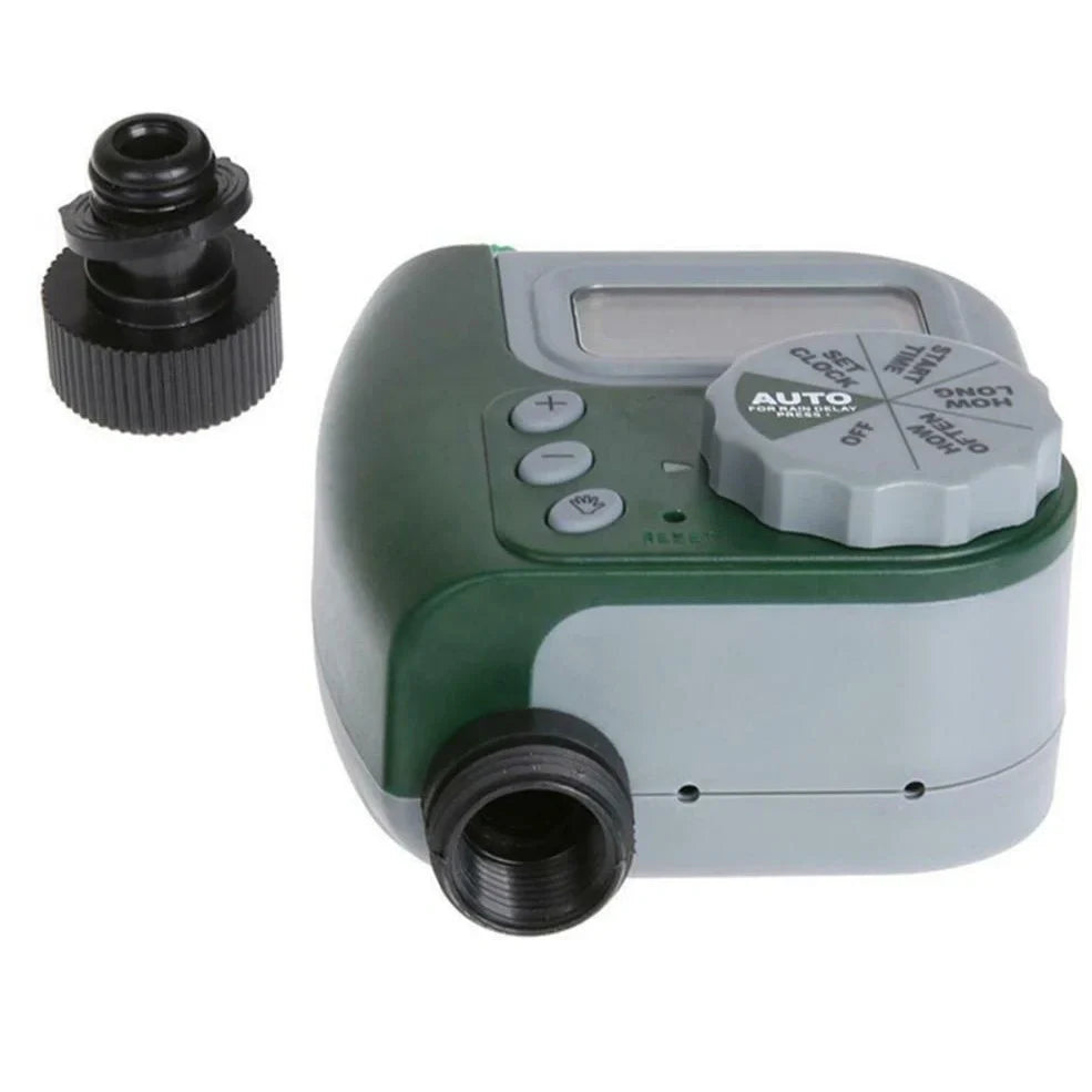 Green garden irrigation controller with LCD display and rotating dial for programming watering schedules