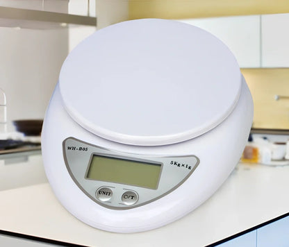 White electronic kitchen scale with digital display showing 1g precision and 5kg capacity measurements
