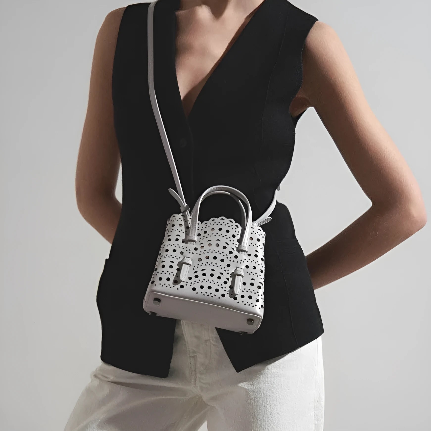 Hollow carved PU messenger tote bag with three straps in horizontal square shape