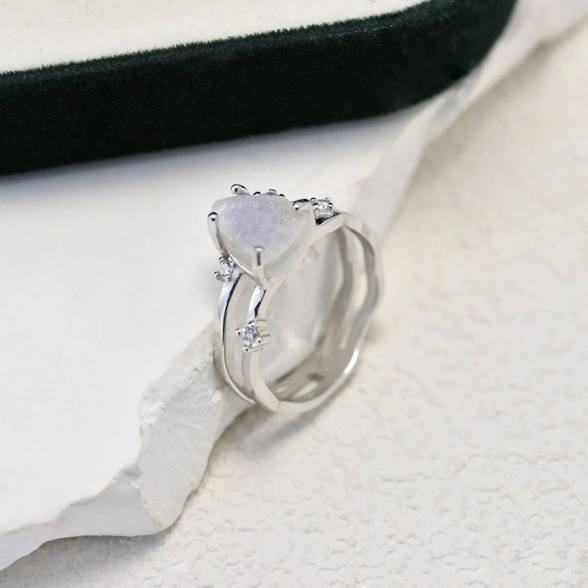S925 sterling silver irregular triangle moonstone ring showing geometric design and 12mm gemstone centrepiece