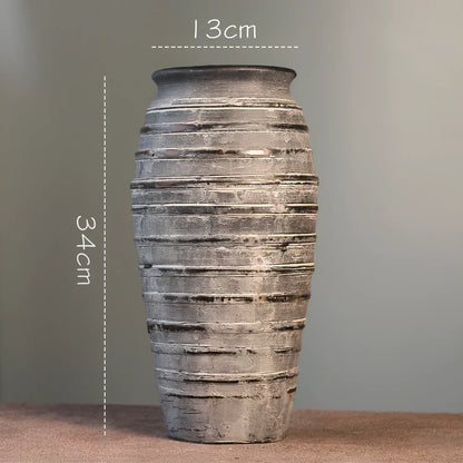 Ceramic mosaic vase with dried flowers, showing mosaic pattern and 25cm height