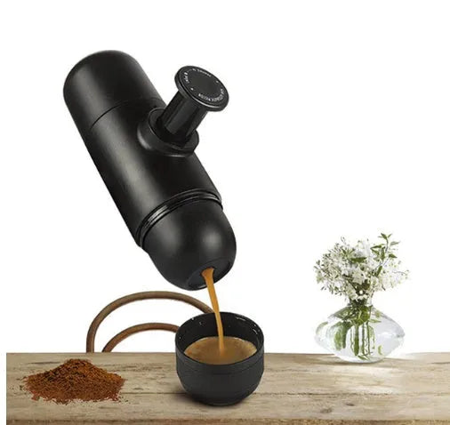 Black portable manual coffee machine with pressure gauge, 6cm wide and 17.5cm tall.