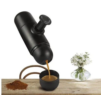 Black portable manual coffee machine with pressure gauge, 6cm wide and 17.5cm tall.
