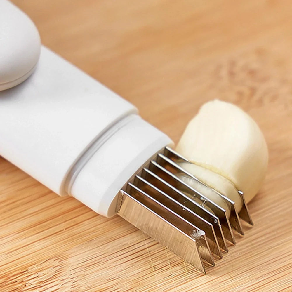 White 3-in-1 rotary paring knife with stainless steel blades showing 360° rotating mechanism