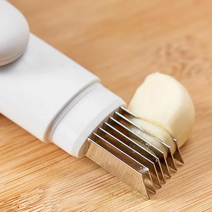 White 3-in-1 rotary paring knife with stainless steel blades showing 360° rotating mechanism