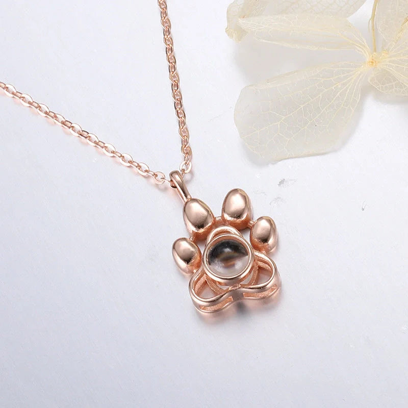 Custom dog paw projection necklace in silver with adjustable chain