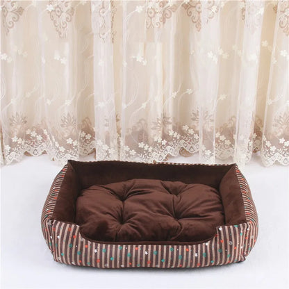 Oval cloth pet bed for dogs or cats in a striped colour pattern, showing its soft cushion shape.