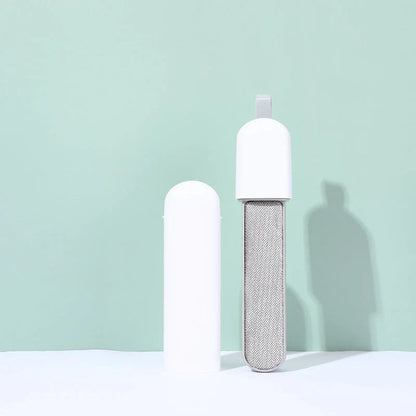 Double-sided electrostatic pet hair remover brush made of durable ABS material with polyester filament bristles