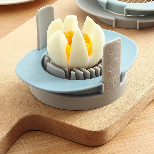 Manual egg cutter in red, blue, and orange with three functions