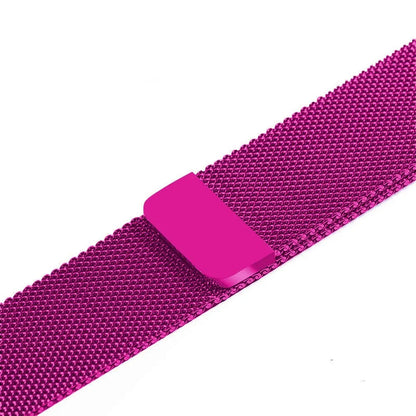 Stainless steel metal link strap for Apple Watch on a wrist, showing deployment clasp and polished finish