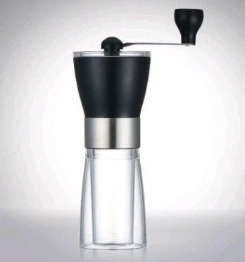Compact manual coffee grinder with wooden body and stainless steel mechanism for fresh ground coffee at home